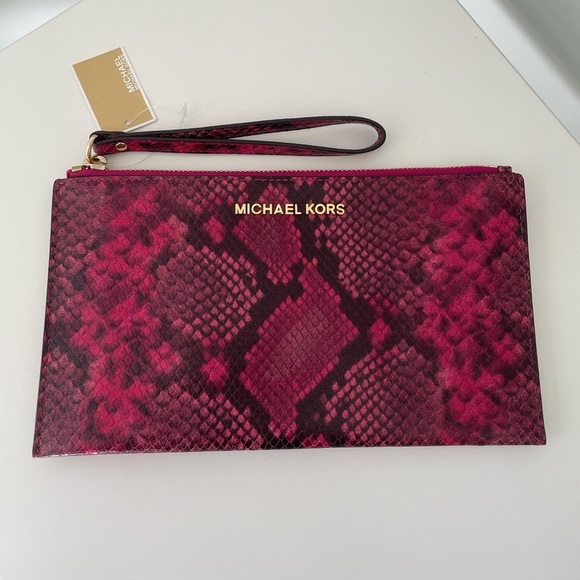 Michael Kors Handbags - Michael Kors Jet Set Large Zip Clutch
Fuschia Snakeskin Embossed Leather
New